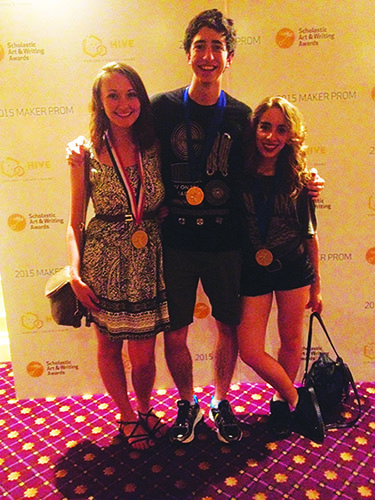 Gelman stands proudly by other medal winners in New York. Gelmans poem, Women, won her the gold medal. 