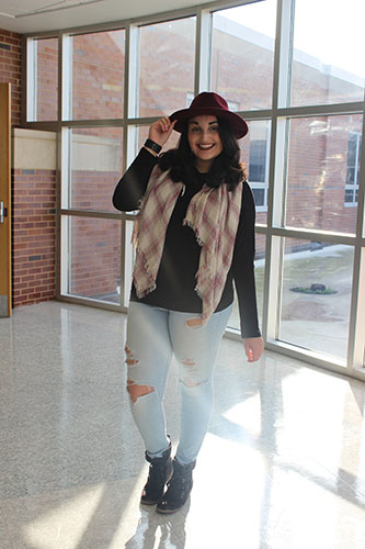 The centerpiece of outfit #1 is definitely the hat. I love both the color maroon and the chic look the hat adds to a basic sweater and jean combo. The hat, scarf and sweater are all courtesy of Forever 21, priced under $15 each. The light-washed ripped jeans are from American Eagle and cost about $40. The black combat boots were from Kohl’s for about $40. This outfit can be worn in many settings: school, home or when you’re out with friends.