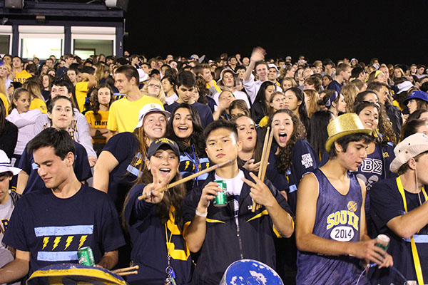 BACK-TO-SCHOOL SPIRIT: Cheering on the varsity football team at their first home game, students demonstrate their school pride. Titan Nation’s presence is more appropriate at football games than in the GBS hallways. 