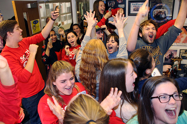 TRIUMPHANT TITANS: Upon hearing the final count of cans collected during the annual Canned Food Drive, Student Council members  scream and shout in their celebration for reaching and exceeding their goal from last year. The starting goal for the Canned Food Drive was 100,015 cans, but this yearís drive yielded a total of 124,000. The cans were donated to Vital Bridges, Onward House and the Northfield Township Food Pantry. 