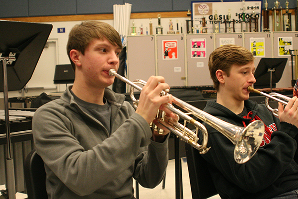 Trumpeteering during a morning Jazz Ensemble practice, junior Jack Kelly performs his piece alongside senior Matt Grinde. Kelly made ensemble his Sophomore year, and has avidly remained a part of the entire music department. 