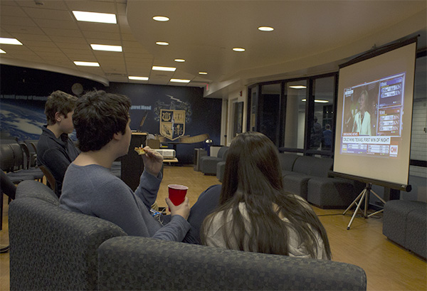 LATE-NIGHT LEARNING: While snacking and socializing, students seeking to be politically informed watch CNN coverage of ìSuper Tuesday,î the first round of presidential primary elections. The event, held in the SAC, was hosted by Young Democrats Club on March 1.