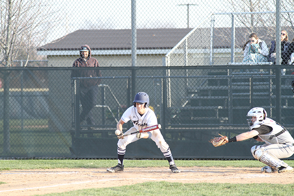 BEATIN THE BALL: Eyes on the ball, junior Cameron Pauly, prepares to bunt. 