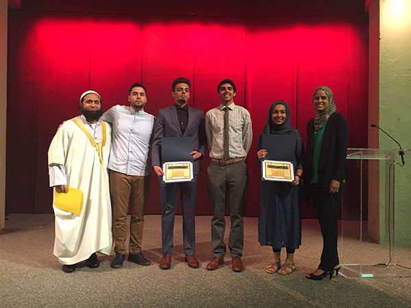 FAITHFUL FRIENDS: Celebrating after being awarded with the North Shore Interfaith Leadership Award, junior Saarah Bhaiji (second from right) smiles with her fellow award winners. She looks to combat religious intolerance from within Souths community. 