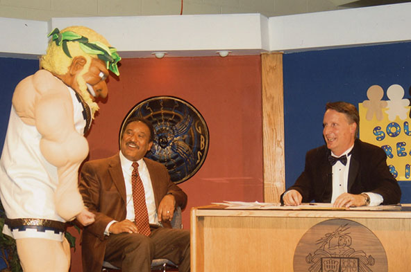 THE TITAN IN ALL OF US:  GBS alumnus Jake Schmidt interacts with former WBBM weatherman Steve Baskerville (left) and Dr. Jim Shellard (right) while dressed up as Tommy the Titan during the 2011 South Telethon. Schmidt, an active member of Student Council, was a part of South’s Special Education Department. 