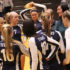 Huddle in for the win: Listening to new head coach Kelly Dorn, the women’s volleyball team huddles and discuses their play after their win against the Niles North. The Titans played and defeated the Vikings on Sept. 27 ending by scores of 25-5 and 25-14.