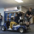 Leading the Lip Dub: Intently filming the 2016 lip dub, Jim Shellard, Student Activities director, and seniors Josh Noll, and George Gould use a golf cart to ensure the steadiness of the footage. The lip dub crew simulated the route every day for three weeks prior to the actual filming of the lib dub in order to guarantee minimal mistakes.