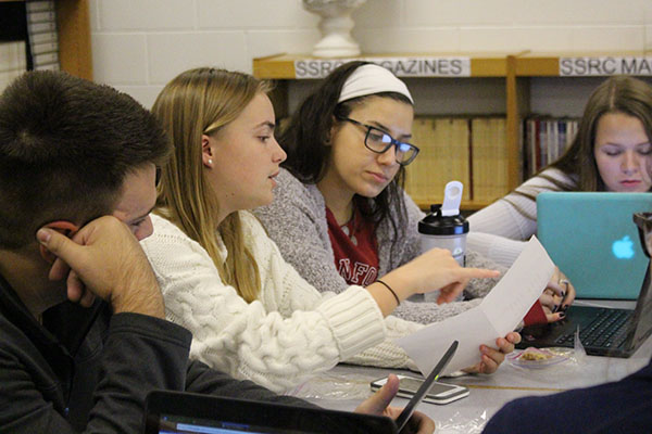 EVERYDAY IS ‘MUN’DAY: Discussing their meeting agenda, seniors Yoana Sidzhimova and Lori Steffel, GBS Model United Nations (MUN) president and vice president, lead their fellow board members. Sidzhimova and Steffel collaborated on an article about MUN that was published in the Johns Hopkins Center for Talented Youth’s magazine Imagine.
