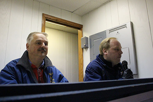 BAND BONDING: Directing a late night marching band practice, Greg Wojcik, directer of Souths Band, and son Aaron Wojcik, assistant band director give instructions to students. This will be Gregs 38th and final year at South as band director. 