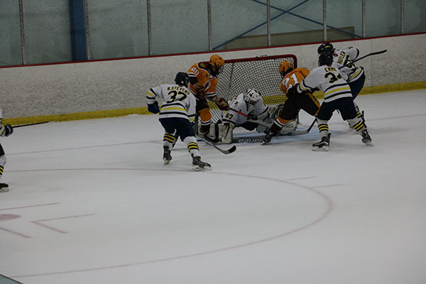Bending down to block out the shot, goalie Paul Zygmunt makes the save against a Loyola Gold offender. The Titans lost to the Ramblers by a score of 4-2. 