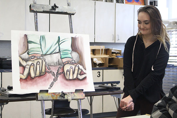 Professional Presentations: Presenting to the class, an AP art student shares the details of their work. The AP students will also be presenting art work at a showcase at Oakton. 