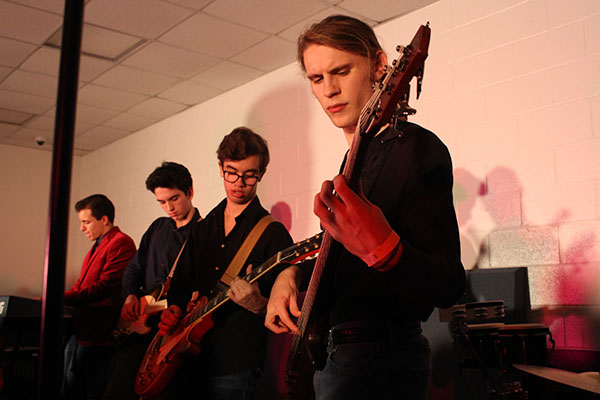 Sound of Sundstrom  :  Playing bass guitar at Battle of the Bands on Dec. 2, junior Jack Sundstrom takes the stage along with senior Antonio Duca and juniors Quinn Smialek and Jack Quinones. Sundstrom is a part of Jazz Band and Orchestra and also plays bass guitar with several groups. Photo by Liz Claire Rodriguez