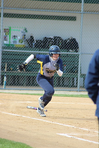 Sprinting to first base, Kuhn looks to make a run against Vernon Hills her sophomore season in 2015. Kuhn will continue her success on the field at Indiana University, according to Kuhn. 