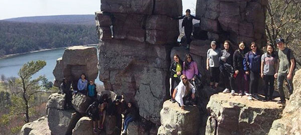 Happy Hikers: Smiling at the camera, GBS Outdoors Club member pose during their hike at Devils Lake State Park. The club was created this past Fall, and they took their first trip to Devils Lake on April 8. Photo courtesy of Christina Moy