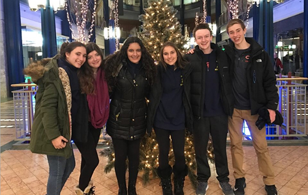 Argumentative Achievements: Standing in their hotel lobby, JV debaters Sabina Roberts, Katie Kenner, Alysa Aralis, Kelly Skoulikaris, Michael Scott and Dylan Goldberg pose for a photo at the John Edie Holiday Debates tournament in Minnesota (Left). Debate Coach Jon Voss said the JV teamís willingness to work together helped them find success at their state competition.