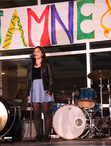 Peaceful Performance:  Singing at Jamnesty, senior Stephanie Zenzola takes part in the event hosted by STAND and Amnesty International. Jamnesty is one event that remained during a changed Peace Advocacy Week. 