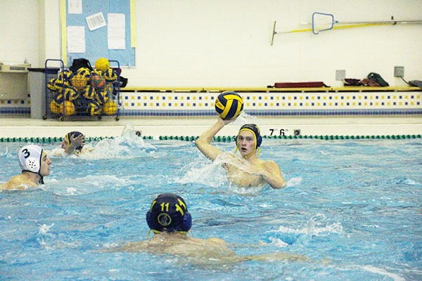 Polo   passin:  Senior leader, Tucker Nienhaus, looks to fellow teamates for a pass during the Titans’ match against GBN on April 11. The Titans defeated the Spartans 19-10.
