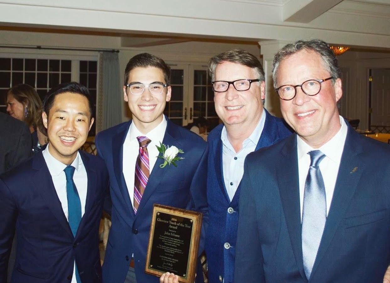 Civic Celebration: Smiling with Key Club sponsor Josh Koo, Dr. Jim Shellard, assistant principal of student activities and Allan Ruter, former GBS English teacher, Graduate John Schurer poses for a photo. Schurer received the award for his involvement in school, particularly service. Photo courtesy of John Schurer.