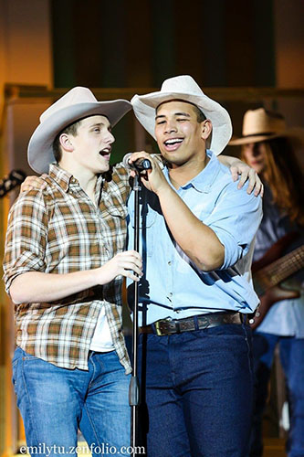 COUNTRY CANDID: Singing at Synchroicity- themed Variety Show in 2017, Zach Adams (right) is accompanied by teammate Christan Cole (left). Adams and Cole participated in the football act last year. Photo courtesy of  Emily Tu