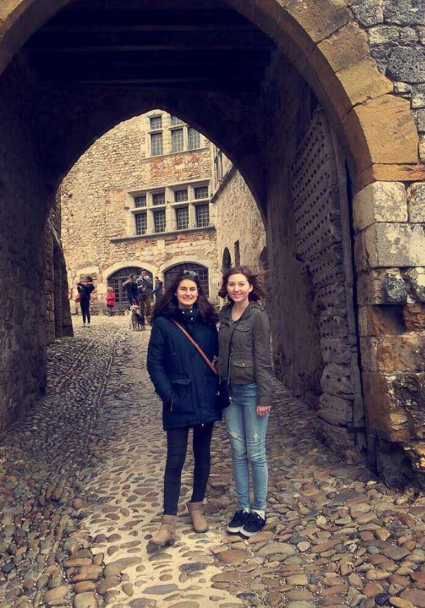FOREIGN FUN: Standing in a street near Lyon, France, Kayt Ribordy (right) and her exchange partner (left) immerse themselves in French culture. Ribordy speaks English, French, Spanish and German.