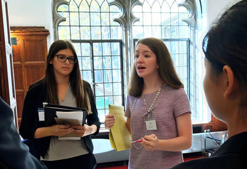 MOTIVATED MCGRATH: Junior Maddy McGrath gives a pep talk to other students at a Model UN conference. McGrath is on the board of Model UN, and is enrolled in AP Government, and AP U.S. History, in hopes of pursuing a career in government in the future. 