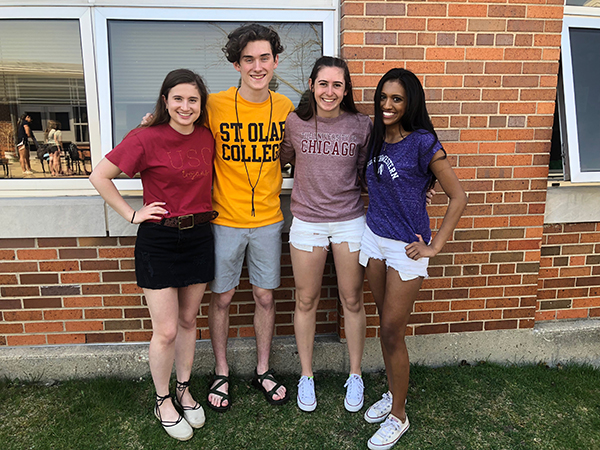 FOUR YEARS OF SMILES: Smiling for pictures on May Day, senior academites (from left to right), Brigid Murphy, George Wood, Elizabeth Shaw and Bonnie Puppala have endured the rigors of Academy. The Glenbrook Academy of International Studies is a four-year GBS & GBN collaborative program promoting an interdiciplinary education in social studies, English and world language.