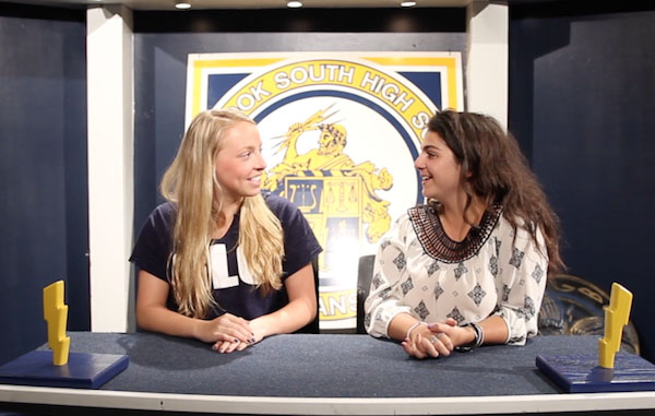 ATTENTIVE ANCHORS: Filming their episode of the Glenbrook South Report, Senior Guest Ellie Eimer and MariaElena Kouriabalis, senior film student, inform students and teachers of upcoming events around the school. The film students placed top three in nine of 16 categories at the Midwest Media Educators Association festival.