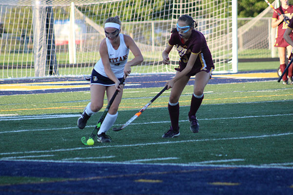 Dribbling up the field, junior Mary Jane McNary focuses on the ball during her game on Sept. 12 against Loyola. Photo by Maricel Lehner 