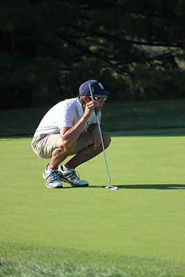   After his stroke, senior Eric Yum follows the ball, waiting to see where it lands.  The boys came back from a rocky start with a chance to compete in Sectionals. 