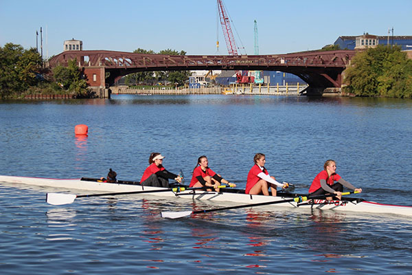 Paddling in sync, Souths rowing team passes the Ashland Avenue bridge on the Chicago River during practice.