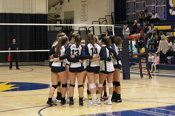  Huddling before a play, the girl’s volleyball team competes for a chance to make a playoff run. The girls’ season ended when they lost to Loyola on Oct. 25.