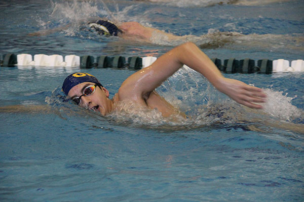 Turning to take a breath, sophomore Sami Moussally competes in the GBS Time Trials on Dec. 1. The Time Trials took place at South where several schools competed. 