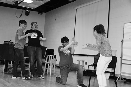 practicing   pals:   Rehearsing a scene, seniors Jack Taylor and Zach Reiss and juniors Brian De Stefano and Kendall Grenolds practice for the annual Senior One-Acts. They will carry on the tradition of many upperclassmen before them on May 15, when they will display their acts. Photo by Naomi Skyles