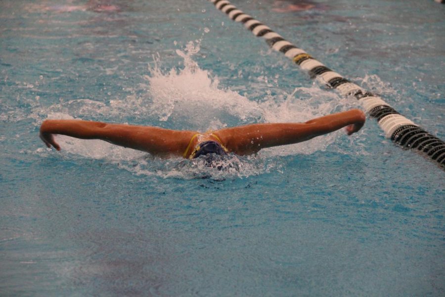 Swimming To Success: Flying to the finish line, junior Mia Kriltchev, girls varsity swimmer aims for victory at the South swim meet against Fremd. South beat Fremd with a final score of 95-93 on the varsity level. 