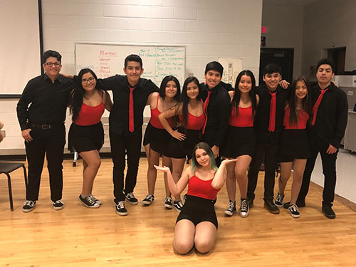 Lively latinos: Getting together for practice, members of Latino Heat walk into a place that feels like a second home to them. They have a special bond with one another, as they have the opportunity to express their ethnicity through dance together. 