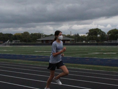 Trouble on the Track: Freshman, Sophia Abraham runs along the track during gym class. 