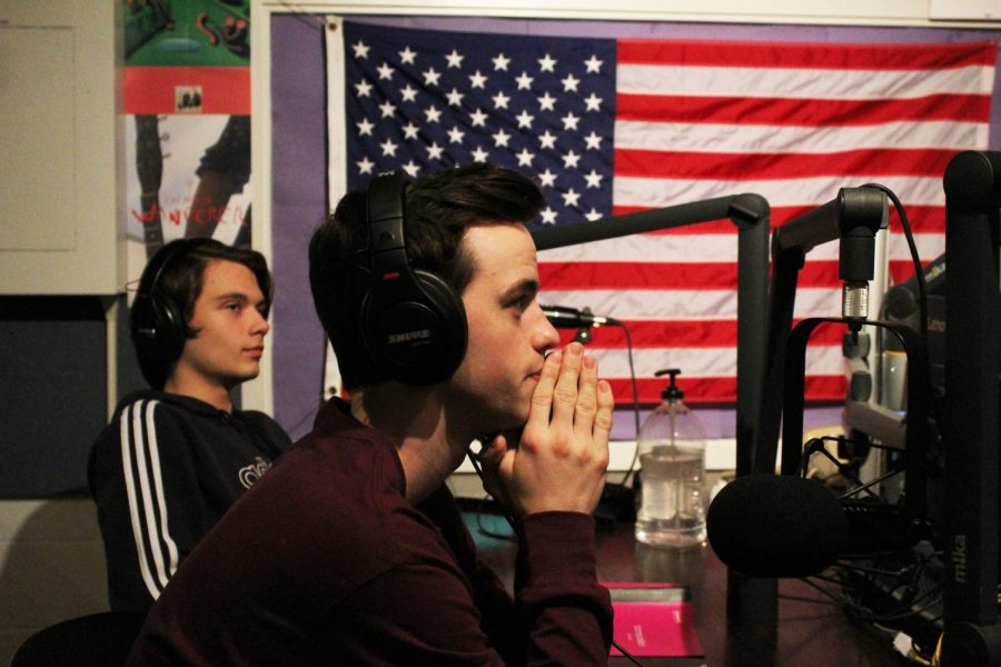 On Air: For their Wednesday afternoon radio show, seniors Will Kasher and Adam Szczerbowski broadcast live from WGBK’s Studio K. Photo by Cali Wilkinson