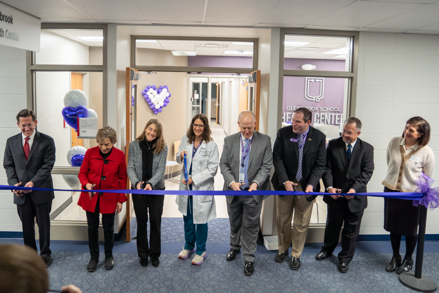 (From left to right): Bruce Doughty, District 225 Board of Education President, U.S. Congresswoman Janet Schakowsky, Laura Fine, Illinois State Senator, Kara Rau, GSHC Nurse Practitioner, Dr. Charles Johns, District 225 Superintendent, Dr. R.J. Gravel, District 225 Associate Superintendent, Peter Glowacki, Board of Education Vice-President, and Dr. Julie Holland, Vice President of Pediatric Care for Advocate Children’s Hospital cut the ribbon for the opening of the Glenbrook School Health Center.