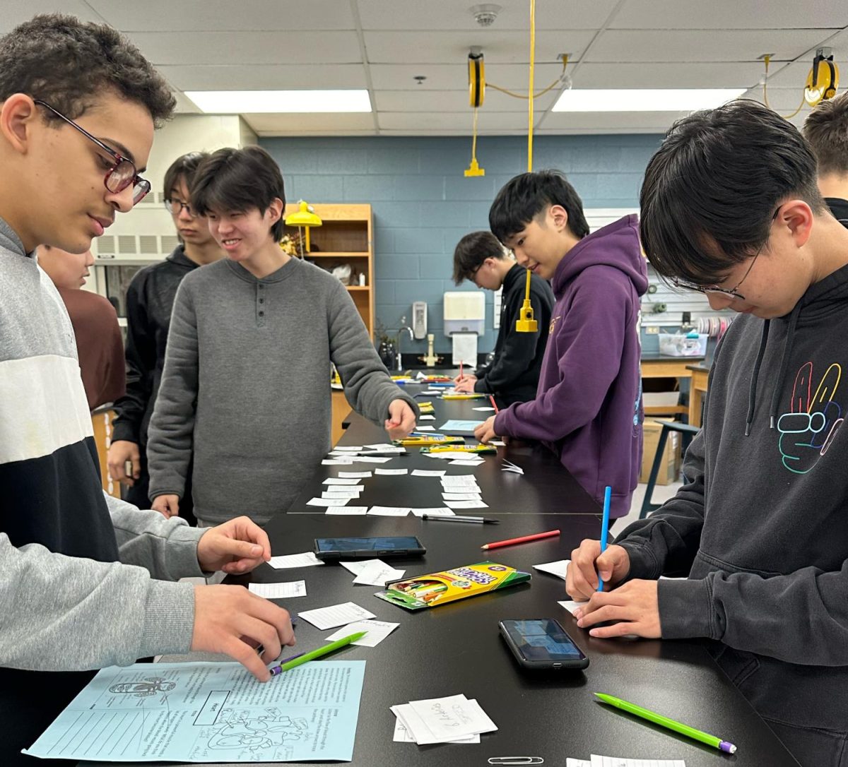 Class in session: Students from the Block 4 Language Assisted (LA) Biology work together to make vocabulary photo cards. Next year, the two LA Science classes will be reorganized into three Multilingual Science classes. 
