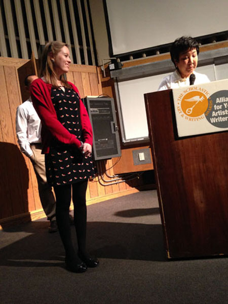 WRITE ON: At the Scholastic Art and Writing Awards ceremony for Chicago, senior Carolyn Kelly is called to the stage by Director Dr. Barbara Kato. Aside from her national Gold Medal, Kelly was awarded three regional Gold Key awards and one regional Silver Key award for her work.
