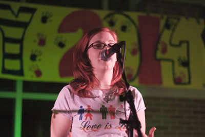 BREAKING THE SILENCE: On stage at Jamnesty, Emily Leonard, Gay Straight Alliance co-president, emphasizes acceptance. The night after the national Day of Silence is called Night of Noise, during which participants are encouraged to be as loud as possible. 