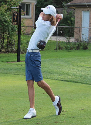 SWINGING INTO SIXTH: Finishing through his swing, junior Charlie Nikitas tees off during practice. Nikitas was the only player from the GBS team to qualify for state, where he placed sixth. 
Photo by Jacqueline DeWitt