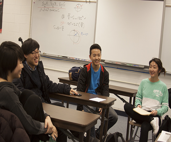 CELEBRATING CHRISTIANITY: Senior H2O members Kevin Jeon (left) and Claudia Choi (right) engage in a conversation with junior member Paul Choi (middle). The club discusses their faith and promotes positive fellowhip within the school. Photo by Jacqueline DeWitt