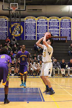 FANCY FREE-THROWS: Preparing to shoot, Senior Captain Jimmy Martinelli (#33) aims to make his free-throw. The men are mid-conference with a record of 8-10, hoping to finish in the top three. 