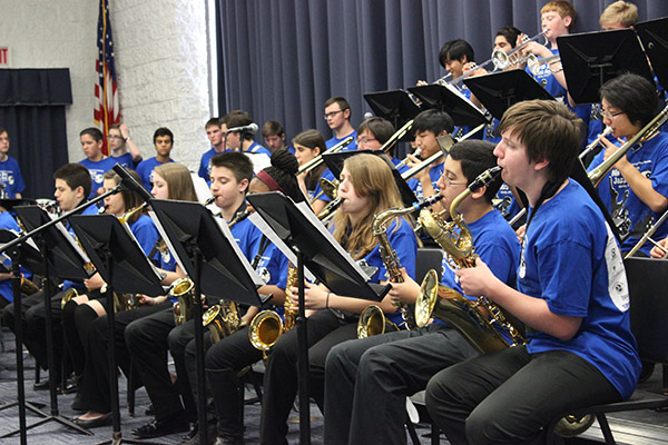 GET JAZZY: Performing with the Glenbrook South Jazz Lab,  junior Kayleigh Markulis, freshman Gus Morales and sophomore Jonah Frese (front) entertained the audience and judges with their saxophones at the Jazz Festival. Their group performed  “Morning Funk,” “Vita Bella” and “The Groove.” 