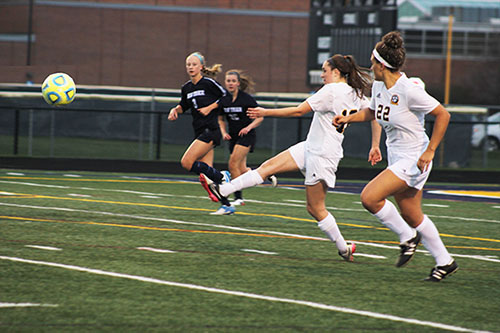 KICKING AND SCREAMING: Following through on a kick, junior Callie Pekosh launches a ball down field during a game against New Trier on April 19. The Titans tied New Trier by a score of 1-1.