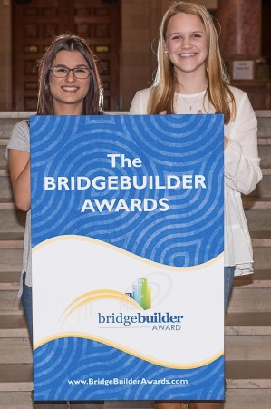 BRIDGEBUILDER BRIANA: Posing with a friend, Briana Flores (left), Glenbrook Evening class of January 2016, was one of 12 Chicago-area students honored on April 9 as a 2016 Techny BridgeBuilder.