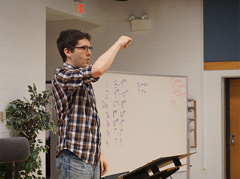 Enlightened by Ermel: Daniel Ermel, new co-choir director, teaches Glee choir class. His goal for students is for them to grow as musicians by looking further into the music they perform. 