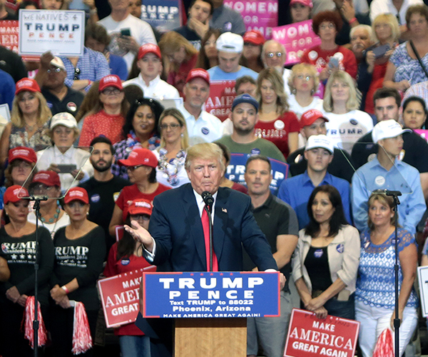 Election emotions: Rallying amongst a crowd of his supporters (right), president-elect Trump speaks at a pro-Trump event in Phoenix, Arizona. Trump was elected President early in the morning of Nov. 9, 2016.