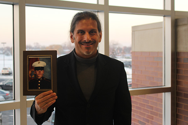 Military time: Displaying his potrait as a former member of the U.S. Marine Corps, Brian Shaoul, Transitional Studies Instructor for Student Services, described that he never saw actual combat. His main role in service was maintaining aircrafts that would fly troops into loading zones.